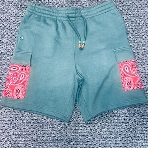 Teal Shorts with Red Paisley Accents